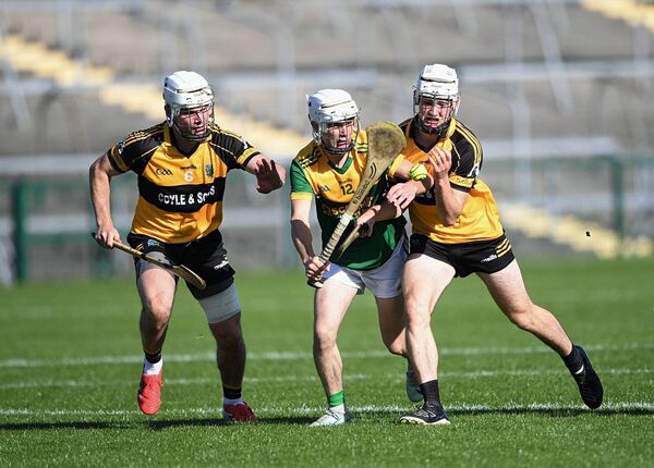 Paddy Fallon is the meat in the sandwich as Four Roads duo, Eamon Mulry and Tommy Morris, tackle the Oran forward during Sunday's county senior hurling semi-final at King and Moffatt Dr. Hyde Park. Paddy Fallon is the meat in the sandwich as Four Roads duo, Eamon Mulry and Tommy Morris, tackle the Oran forward during Sunday's county senior hurling semi-final at King and Moffatt Dr. Hyde Park.
