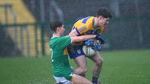 <p>Roscommon forward John McGuinness tries to maintain pressure, under pressure from Leitrim defender Luke Bramm-Farrell, in the tough conditions at King and Moffatt Dr. Hyde Park on Wednesday evening. Picture: Bernie O'Farrell</p> <p>Roscommon forward John McGuinness tries to maintain pressure, under pressure from Leitrim defender Luke Bramm-Farrell, in the tough conditions at King and Moffatt Dr. Hyde Park on Wednesday evening. Picture: Bernie O'Farrell</p>
